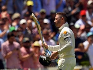 Australian captain Michael Clarke receives a standing ovation as he leaves the field following his dismissal for his 148 run innings against England during day two of the second Ashes Test cricket match in Adelaide on December 6, 2013