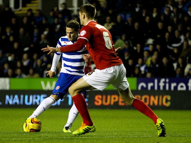 Billy Sharp of Reading scores the opening goal of the game during the Sky Bet Championship match between Reading and Charlton Athletic at Madejski Stadium on December 3, 2013