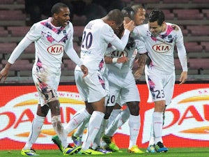 Bordeaux's players celebrate after scoring the opening goal against Guingamp during their Ligue 1 match on December 4, 2013