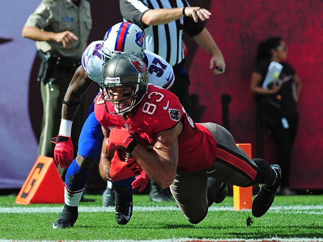 Vincent Jackson #83 of the Tampa Bay Buccaneers makes a catch for a touchdown against Nickell Robey #37 of the Buffalo Bills at Raymond James Stadium on December 8 2013