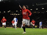 Carlos Tevez celebrates one of his four goals for Manchester United against Blackburn Rovers on December 03, 2008.