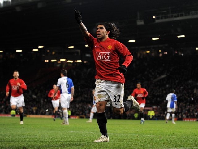 Carlos Tevez celebrates one of his four goals for Manchester United against Blackburn Rovers on December 03, 2008.