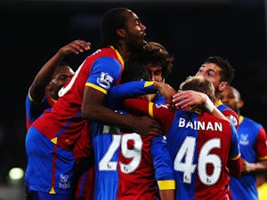 Marouane Chamakh of Crystal Palace is surrounded by team mates after scoring during the Barclays Premier League match between Crystal Palace and Cardiff City at Selhurst Park on December 07, 2013