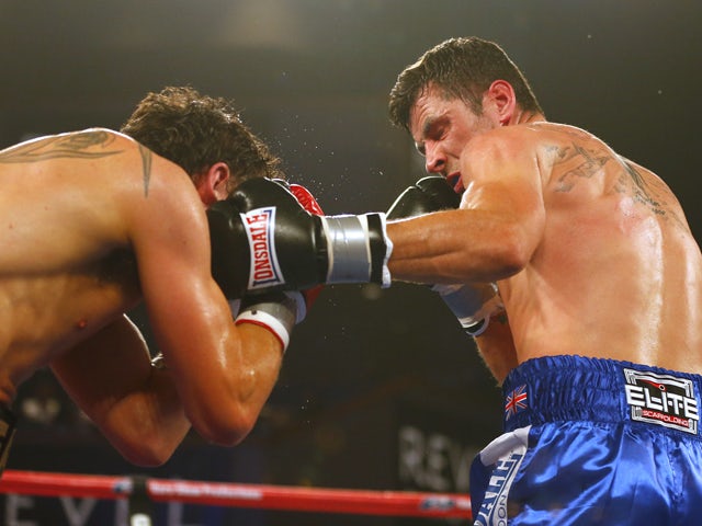 Daniel Geale, left, from Australia is hit in the face by a left punch by Darren Barker of England in the third round during their IBF Middleweight Championship fight on August 17, 2013