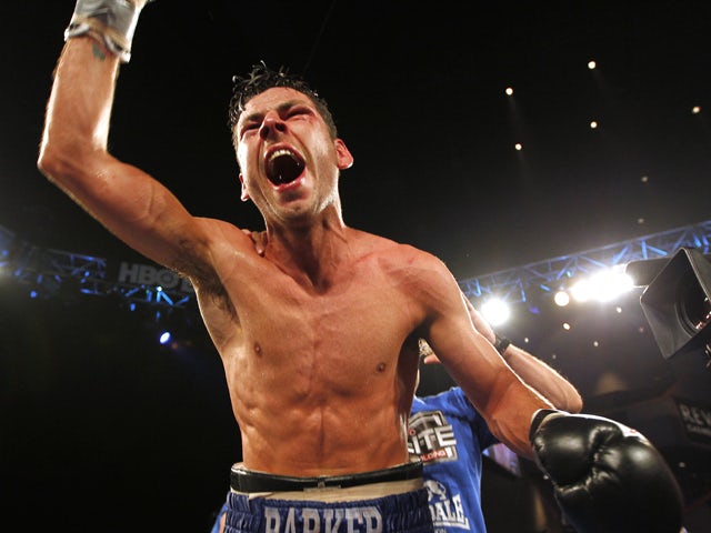 Darren Barker of England celebrates his split decision victory over Daniel Geale from Australia during their IBF Middleweight Championship fight on August 17, 2013