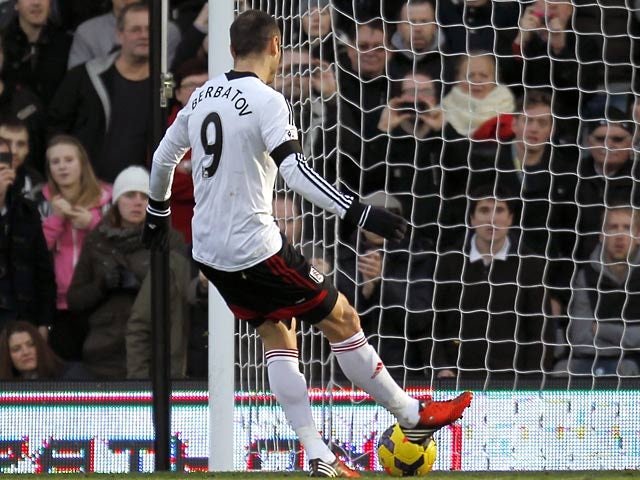 Fulham's Dimitar Berbatov scores his team's second goal via the penalty spot against Aston Villa during their Premier League match on December 8, 2013