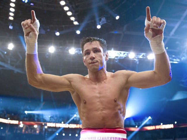 German World middleweight champion Felix Sturm celebrates after the fight against his English contender Martin Murray at the SAPArena in Mannheim, southern Germany on December 2, 2011