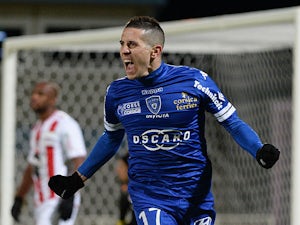 Bastia's Florian Raspentino celebrates after scoring the opening goal against Ajaccio during their Ligue 1 match on December 4, 2013