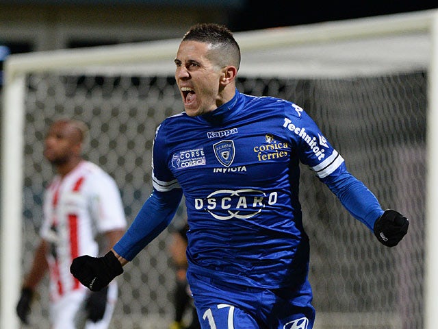 Bastia's Florian Raspentino celebrates after scoring the opening goal against Ajaccio during their Ligue 1 match on December 4, 2013