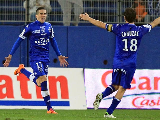Bastia's Florian Raspentino celebrates after scoring the opening goal against Lyon during their Ligue 1 match on December 8, 2013