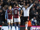 Fulham's Bulgarian striker Dimitar Berbatov celebrates scoring from the penalty spot during the English Premier League football match between Fulham and Aston Villa at Craven Cottage in London on December 8, 2013