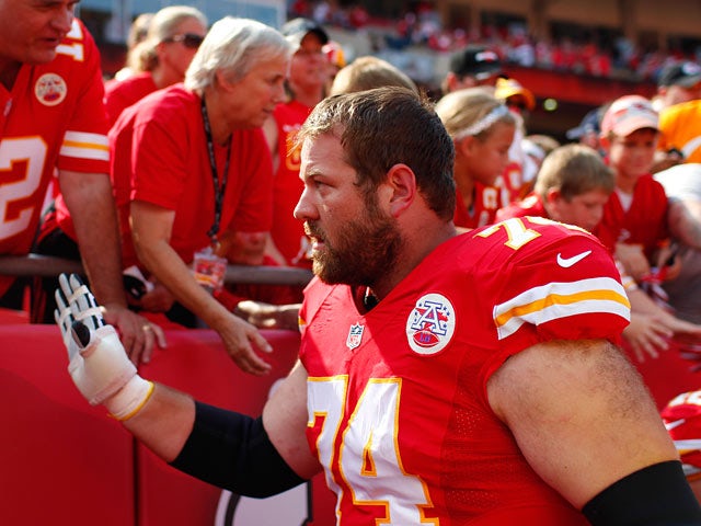 Kansas City Chiefs' Geoff Schwartz greets fans after the victory over Dallas Cowboys on September 15, 2013