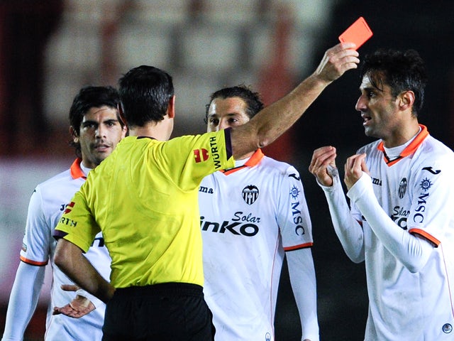 Jonas Goncalves of Valencia CF is shown a red card by the referee Jose Antonio Teixeira during the Copa del Rey round of 32 match between Gimnastic de Tarragona and Valencia at Nou Stadi on December 8, 2013 