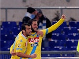 Napoli's Goran Pandev celebrates with teammate Goran Pandev after scoring his team's third goal against Lazio during their Serie A match on December 2, 2013