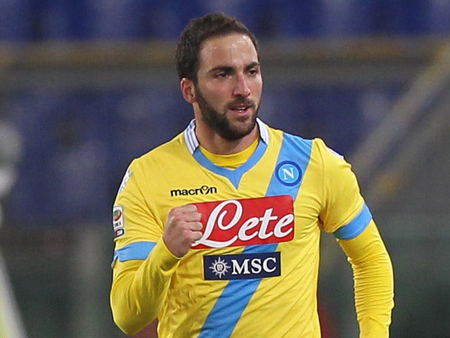 Napoli's Gonzalo Higuain celebrates after scoring the opening goal against Lazio during their Serie A match on December 2, 2013