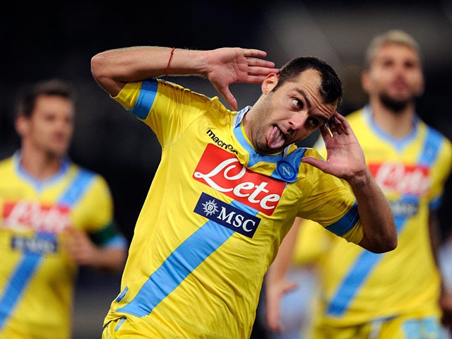 Napoli's Goran Pandev celebrates after scoring his team's second goal against Lazio during their Serie A match on December 2, 2013