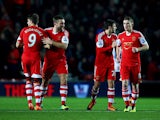 Southampton's Jay Rodriguez celebrates with teammates after scoring his team's opening goal against Aston Villa during their Premier League match on December 4, 2013