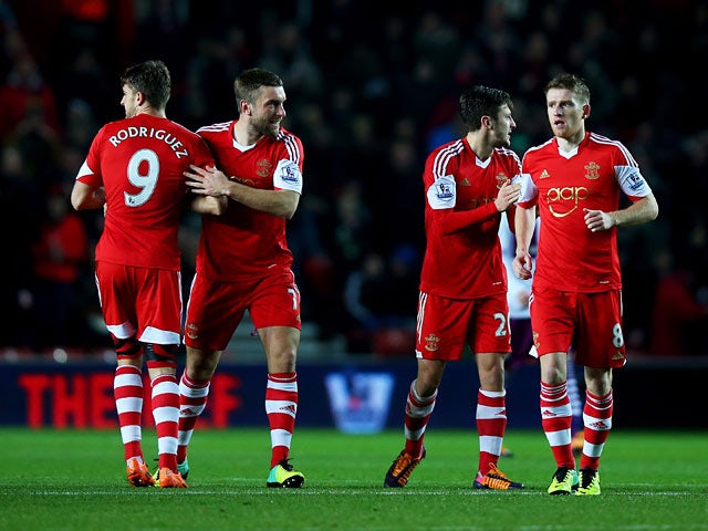 Southampton's Jay Rodriguez celebrates with teammates after scoring his team's opening goal against Aston Villa during their Premier League match on December 4, 2013
