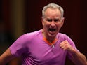John McEnroe reacts during day two of his Statoil Masters Tennis match against Wayne Ferreira on December 5, 2013