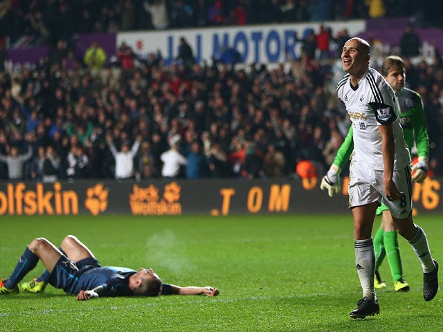 Swansea's Jonjo Shelvey celebrates after scoring his team's second goal against Newcastle during their Premier League match on December 4, 2013