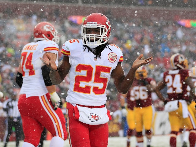 Running back Jamaal Charles #25 of the Kansas City Chiefs celebrates after rushing for a first quarter touchdown against the Washington Redskins at FedExField on December 8, 2013