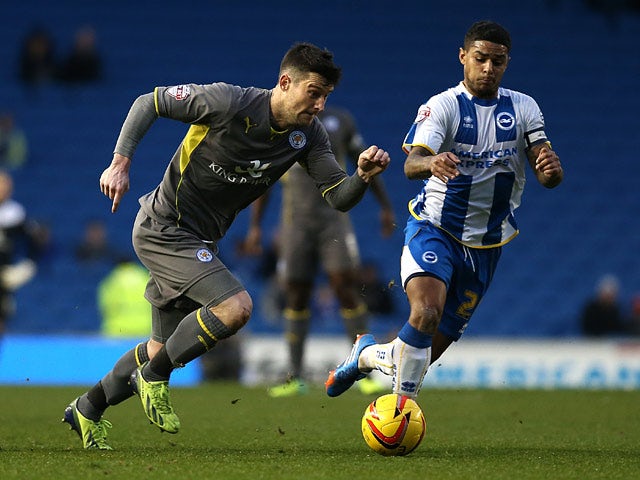 Brighton's Liam Bridcutt and Leicester's David Nugent in action during their Championship match on December 7, 2013