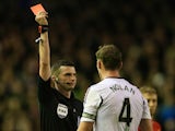 Kevin Nolan of West Ham United is shown a red card by Referee Michael Oliver during the Barclays Premier League match between Liverpool and West Ham United at Anfield on December 7, 2013