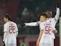 AC Milan Mario Balotelli (R) celebrates with teammate forwad Stephan el Shaarawy after scoring a free kick during the Serie A football match Livorno vs AC Milan at the Armando Picchi stadium in Livorno on December 7, 2013