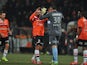 Rennes' players celebrate their victory at the end of the French L1 football match Lorient vs Rennes on December 7, 2013