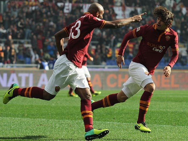 Roma's Maicon celebrates with teammate Dodo after scoring the opening goal against Fiorentina during their Serie A match on December 8, 2013