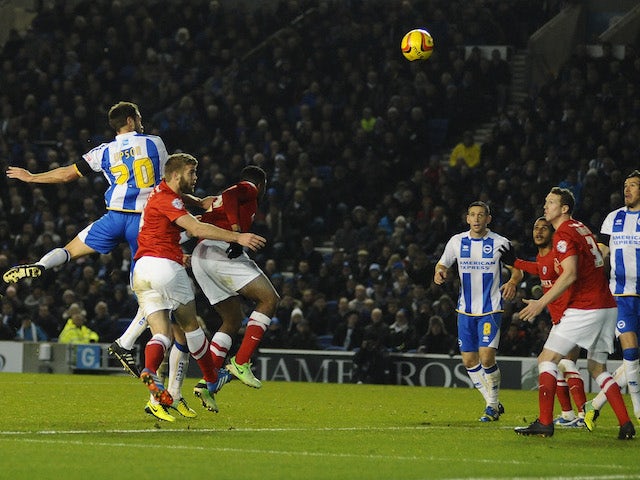 Matthew Upson scores for Brighton during the Sky Bet Championship match between Brighton & Hove Albion and Barnsley at The Amex Stadium on December 03, 2013