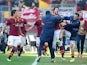 Roma's Mattia Destro celebrates with teammates after scoring his team's second goal against Fiorentina during their Serie A match on December 8, 2013