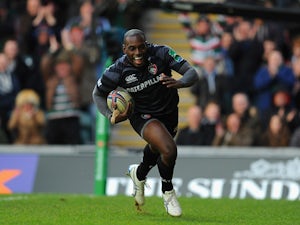 Leicester Tigers' Miles Benjamin runs in to score a try against Montpellier during their Heineken Cup match on December 8, 2013