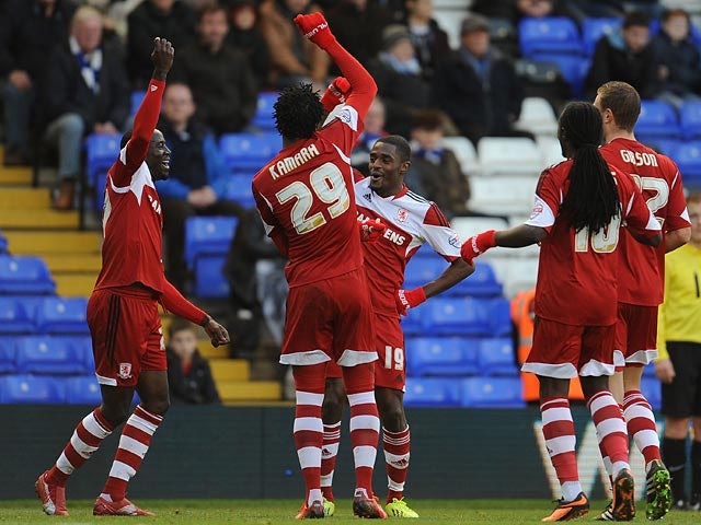 Middlesbrough's Mustapha Carayol celebrates with teammates after scoring the opening goal against Birmingham during their Championship match on December 7, 2013
