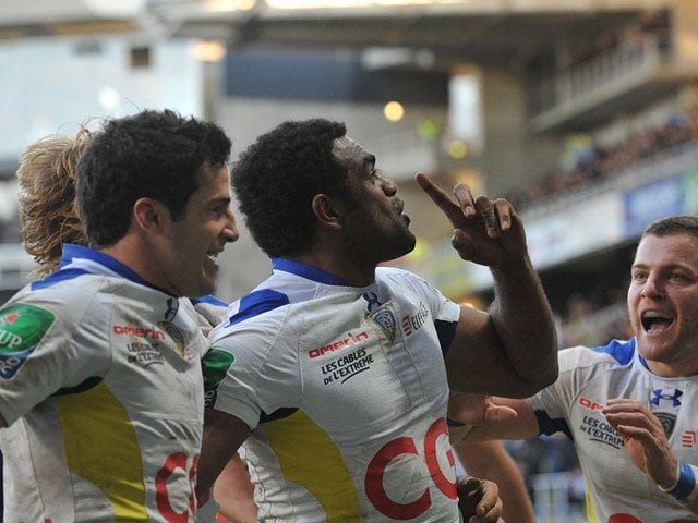 Clermont-Auvergne's Napolioni Nalaga celebrates with teammates after scoring a try against Llanelli Scarlets during their Heineken Cup match on December 7, 2013