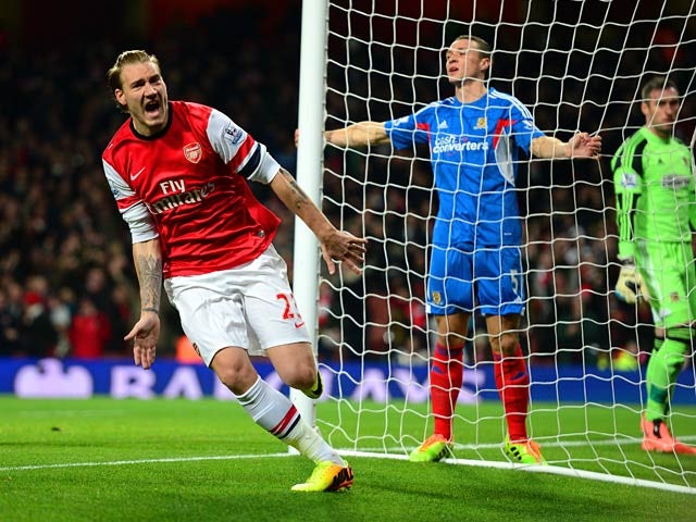 Arsenal's Nicklas Bendtner celebrates after scoring the opening goal against Hull during their Premier League match on December 4, 2013