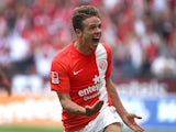 Mainz' Nicolai Mueller celebrates after scoring against Stuttgart during their Bundesliga match on August 11, 2013