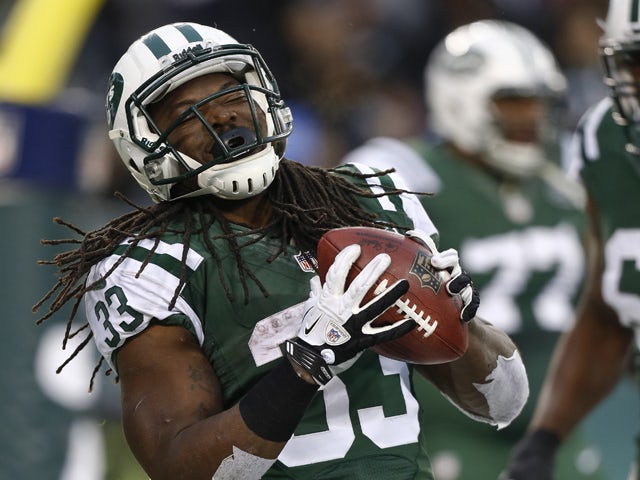 Chris Ivory #33 of the New York Jets celebrates his touchdown against the Oakland Raiders during their game at MetLife Stadium on December 8, 2013