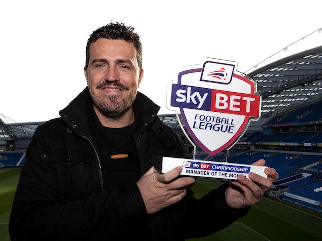 Brighton manager Oscar Garcia with his November Manager Month award on December 5, 2013
