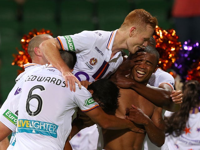 Sidnei Sciola Moraes of the Glory celebrates with team mates after kicking a goal during the round nine A-League match between Perth Glory and the Wellington Phoenix at nib Stadium on December 6, 2013