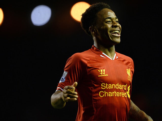 Liverpool's Raheem Sterling celebrates after scoring his team's fifth goal against Norwich during their Premier League match on December 4, 2013