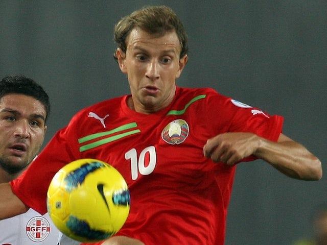 Belarus's Renan Badrin Bressan vies with Georgia's Murtaz Daushvili during their FIFA 2014 World Cup qualifying match in Tbilisi, on September 7, 2012