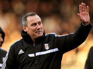 Rene Meulensteen the Fulham head coach waves to the fans prior to kickoff during the Barclays Premier League match between Fulham and Swansea City at Craven Cottage on November 23, 2013