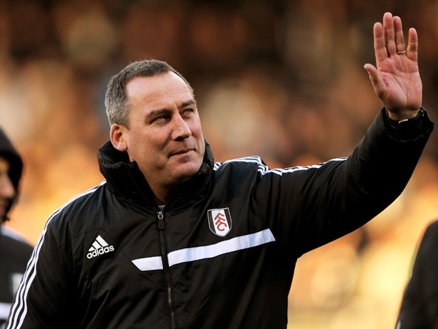 Rene Meulensteen the Fulham head coach waves to the fans prior to kickoff during the Barclays Premier League match between Fulham and Swansea City at Craven Cottage on November 23, 2013