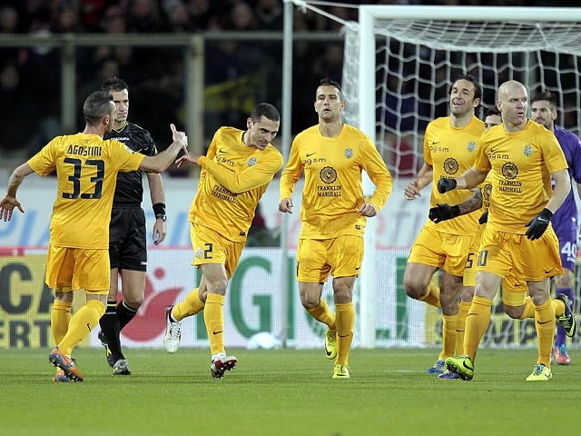 Hellas Verona's Romulo celebrates after scoring his team's opening goal against Fiorentina during their Serie A match on December 2, 2013