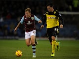 Scott Arfield of Burnley in action with George Thorne of Watford during the Sky Bet Championship match between Burnley and Watford at Turf Moor on December 03, 2013