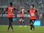 Rennes' Silvio Romero is congratulated by teammate Jonathan Pitroipa after scoring the opening goal against Saint Etienne during their Ligue 1 match on December 4, 2013
