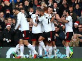 Fulham's Steve Sidwell celebrates with teammates after scoring the opening goal against Aston Villa during their Premier League match on December 8, 2013