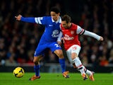Everton's Steven Pienaar and Arsenal's Santi Cazorla in action during their Premier League match on December 8, 2013