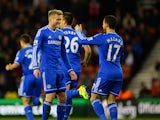 Goalscorer Andre Schurrle of Chelsea celebrates with teammate Eden Hazard after scoring his team's second goal during the Barclays Premier League match between Stoke City and Chelsea at Britannia Stadium on December 7, 2013